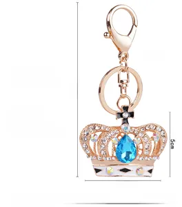 Detailed size specifications for the gold crystal crown keychain with blue gemstone pendant