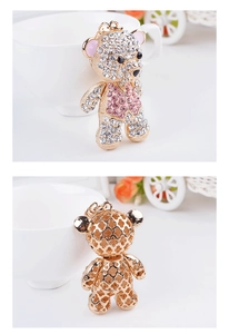 Detailed view of rhinestone teddy bear keychain with exquisite clover hollow back