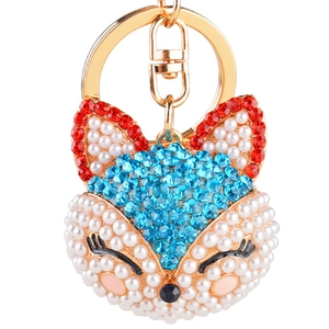 Porte-clés tête de renard mignon avec cristaux rouges et bleus et perles blanches