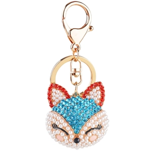 Porte-clés tête de renard avec strass bleu clair et élégantes perles blanches