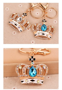 Detailed macro view of a golden crystal crown keychain with rhinestones and a lobster clasp