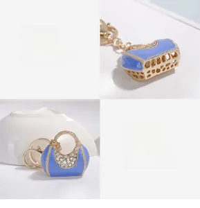 Detailed macro view of the blue pearl handbag keychain with rhinestones and lobster clasp