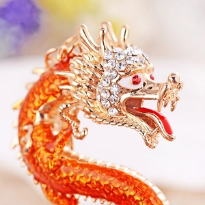 Exquisite golden Chinese dragon keychain with orange scales and sparkling rhinestones