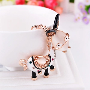 Cartoon donkey keychain with cat eye stone and rhinestones in rose gold frame