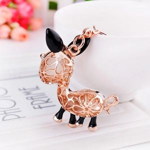 Rose gold hollow giraffe keychain featuring elegant floral cutout patterns and link chain
