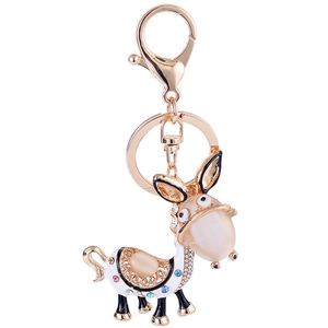 Cartoon donkey keychain with cat eye stone and rhinestones in gold finish