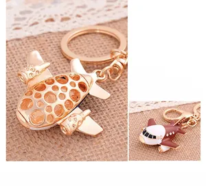 Detailed close-up of A380 airplane model keychain in gold hollow and red finishes