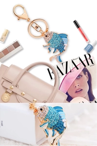 Detail of a crystal goldfish keychain with blue rhinestones and gold alloy metal ring