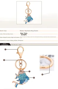 Detailed view of enamel goldfish keychain with blue crystals and lobster clasp, 13cm length