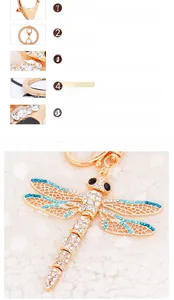 Close-up of rose gold dragonfly keychain with blue rhinestones and mesh wings detail