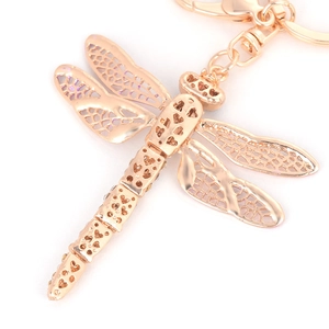 Rose gold dragonfly keychain with sparkling crystals and intricate filigree wings
