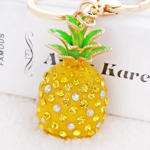 Sparkling pineapple keychain with colorful rhinestones and green enamel leaves