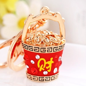 Lucky bucket keychain with golden ingots and sparkling rhinestones in traditional style