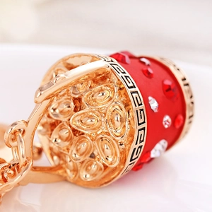 Traditional Chinese lucky bucket keychain with red rhinestones and golden ingots detail