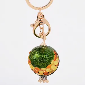 Chic pomegranate fruit keychain with colorful beads and sparkling crystals on gold metal