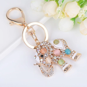 Porte-clés éléphant doré orné de pierres opales colorées et cristaux brillants
