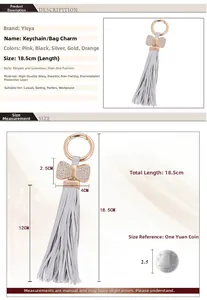 Macro detail of grey leather tassel keychain with crystal bow and size measurements