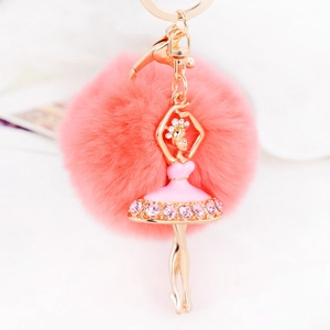 Fashionable pink pom-pom keychain featuring a crystal ballet dancer charm and gold metal ring