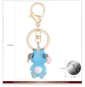 Détail des dimensions du porte-clés éléphant bleu avec perle et pièce de référence
