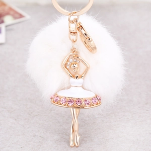 Elegant ballet dancer keychain with white fluffy fur ball and gold metal plating finish