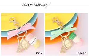 Detail view of macaron keychains with silk bows and Eiffel Tower charms in pink and green