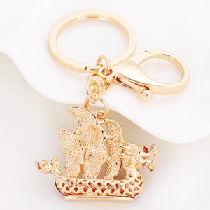 Exquisite golden dragon boat keychain with sparkling rhinestones and sail design