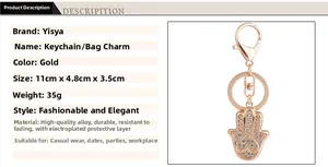 Détails du porte-clés Main de Hamsa en or rose avec strass et fermoir mousqueton