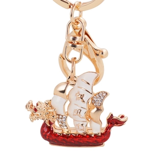 Traditional Chinese dragon boat keychain with red enamel sails and sparkling rhinestones