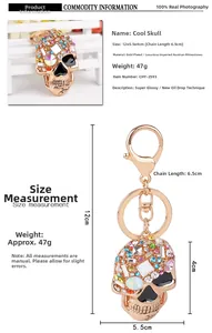 Macro view of skull keychain showing rose gold plating and colorful Austrian crystals
