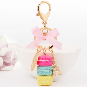 French macaron keychain with pastel charms, pink bow and golden Eiffel Tower charm