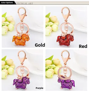 Detailed view of Chinese zodiac horse keychains in gold, red and purple with enamel craft