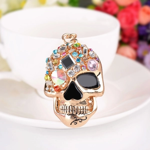 Creative skull keychain with colorful rhinestones on a polished golden metal base