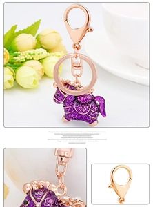Detail of purple enamel pony keychain with sparkling rhinestones and rose gold lobster clasp