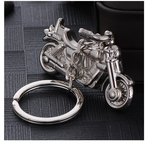 Detailed silver motorcycle keychain featuring realistic metal engine and wheel components