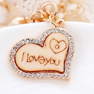 Portachiavi cuore oro rosa con incisione I Love You in legno e bordo in cristallo lucido
