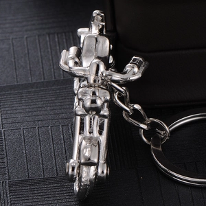 Polished silver metal motorcycle keychain with detailed handlebar and wheel design