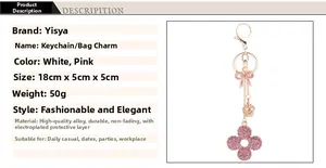 Detail of pink crystal bow and crown keychain with dimensions 18cm length and alloy build