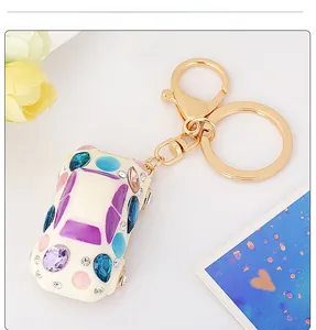 Detail of beetle car keychain with colorful rhinestones and gold alloy plating