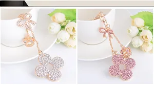 Exquisite clover and crown keychains with crystals in white and pink color options