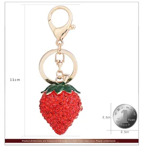 Detail view of red rhinestone strawberry keychain with size labels and 11cm length measurement