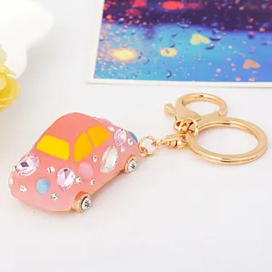 Pink beetle car keychain with sparkling crystals and golden alloy spring ring