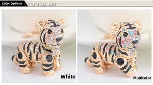 Detail view of crystal tiger keychains in sparkling white and rainbow multicolor options
