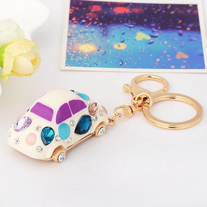 Exquisite beetle car keychain with colorful rhinestones and cream enamel finish