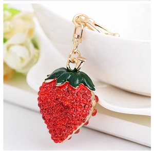 Exquisite strawberry keychain featuring red rhinestones and gold metal lobster clasp
