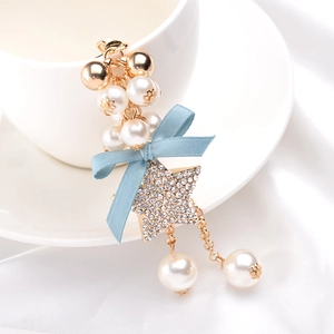 Exquisite pearl keychain with light blue silk bow and sparkling rhinestone star pendant