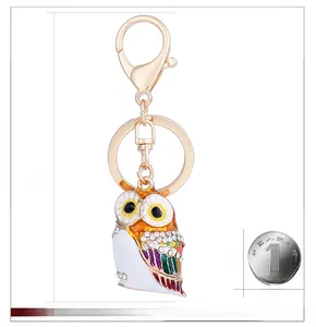 Close-up of owl keychain featuring colorful enamel finish and sparkling crystal accents