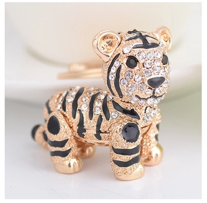 Macro shot of 3D tiger keychain with sparkling rhinestones and gold alloy finish