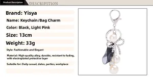 Detail showing 13cm pearl ribbon keychain with rhinestone bow and translucent black fabric
