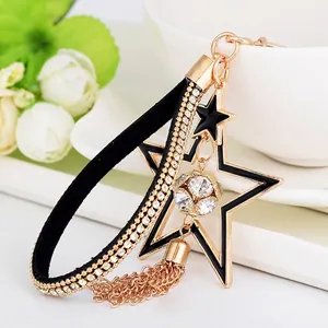 Portachiavi a Stella in Lega d'Oro con Sfera di Strass e Nappine in Metallo per Donna Ciondolo Borsa Stelle in Smalto