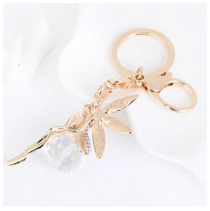 Detailed view of the gold alloy leaf keychain with faceted crystal beads and lobster clasp